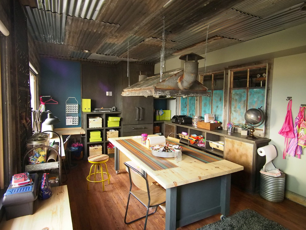 Large urban medium tone wood floor basement photo in Denver