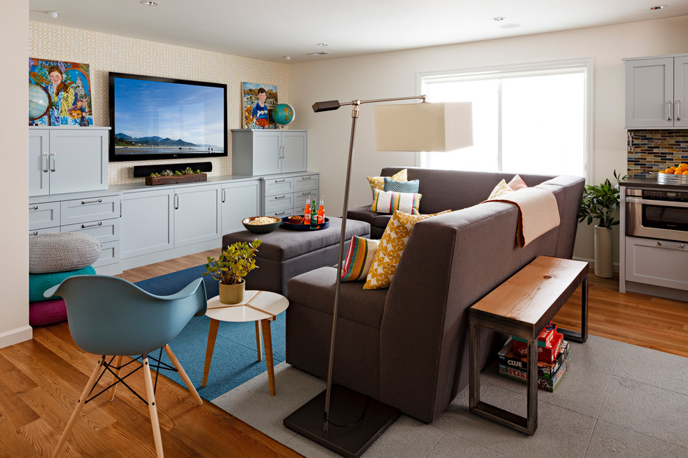 Basement - transitional look-out medium tone wood floor basement idea in Portland with white walls and no fireplace