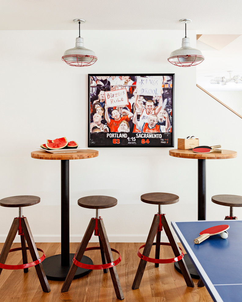 Inspiration for a contemporary games room in Portland with white walls, medium hardwood flooring and a game room.
