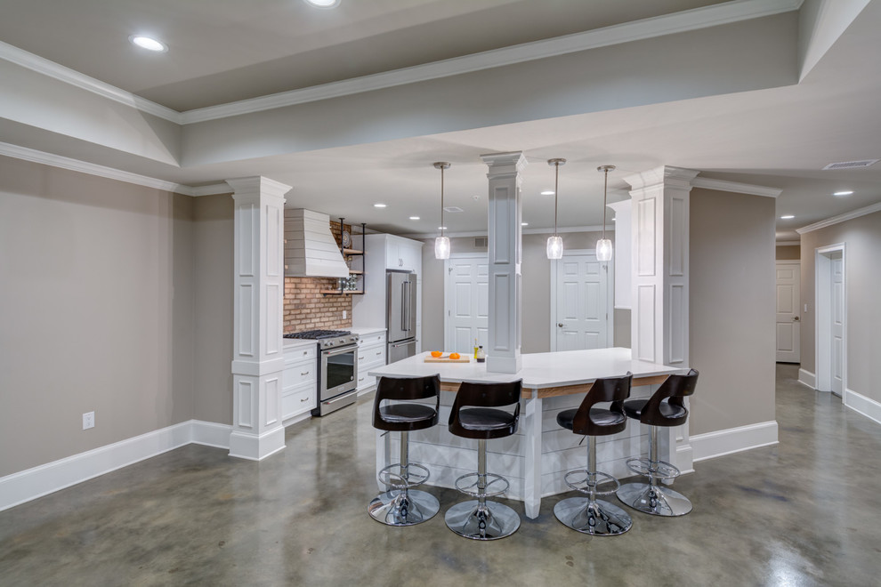 Example of a large urban walk-out concrete floor and gray floor basement design in Atlanta with gray walls