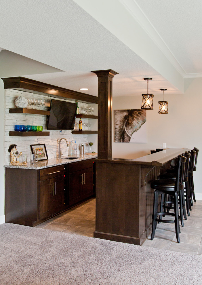 Example of a large cottage walk-out carpeted and gray floor basement design in Kansas City with beige walls