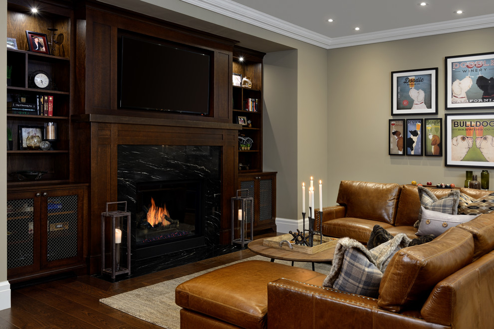 Large classic look-out basement in Toronto with beige walls, dark hardwood flooring and a stone fireplace surround.