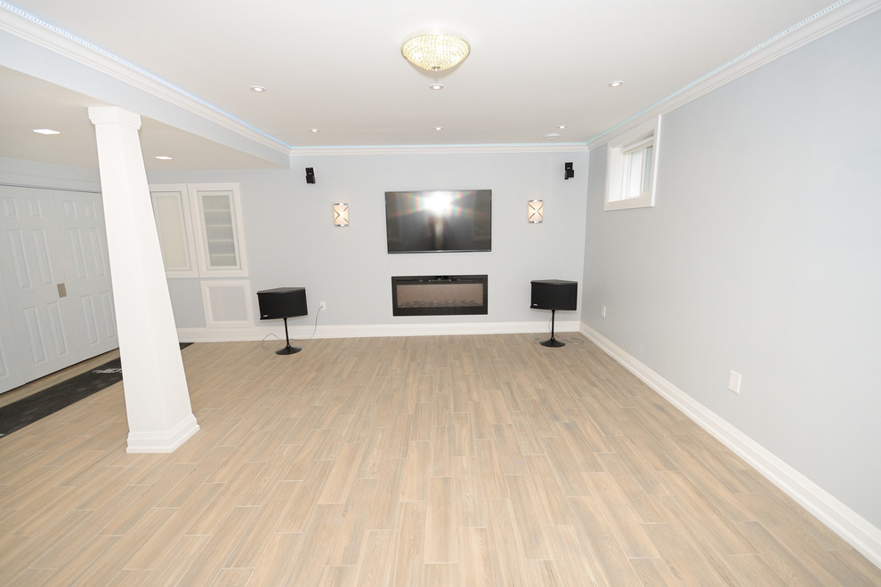 Basement - large contemporary look-out porcelain tile basement idea in Toronto with blue walls and a standard fireplace