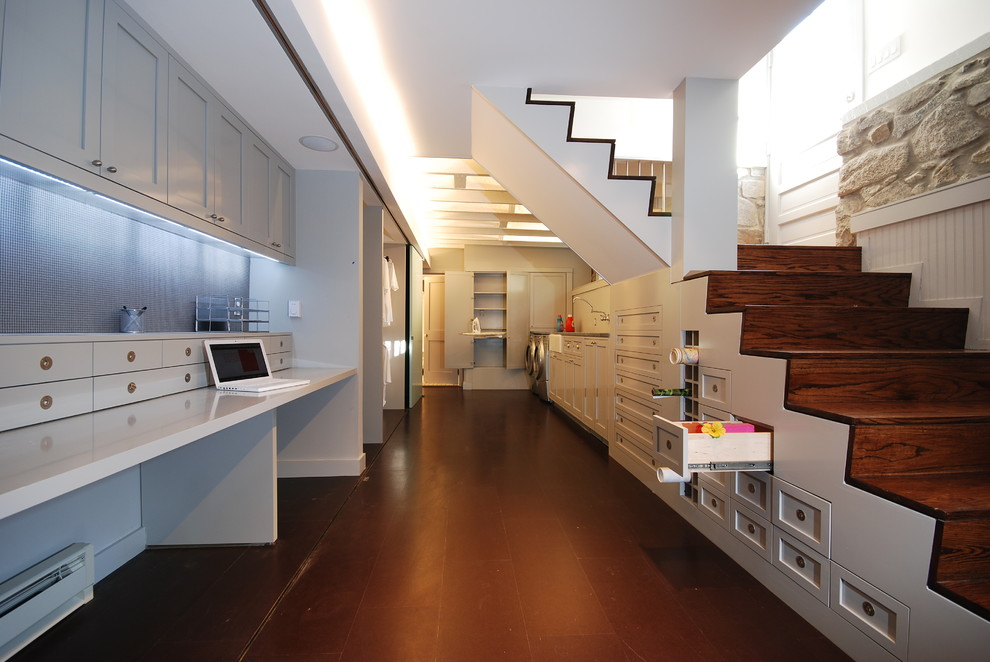 Inspiration for a transitional underground basement remodel in DC Metro with white walls and no fireplace