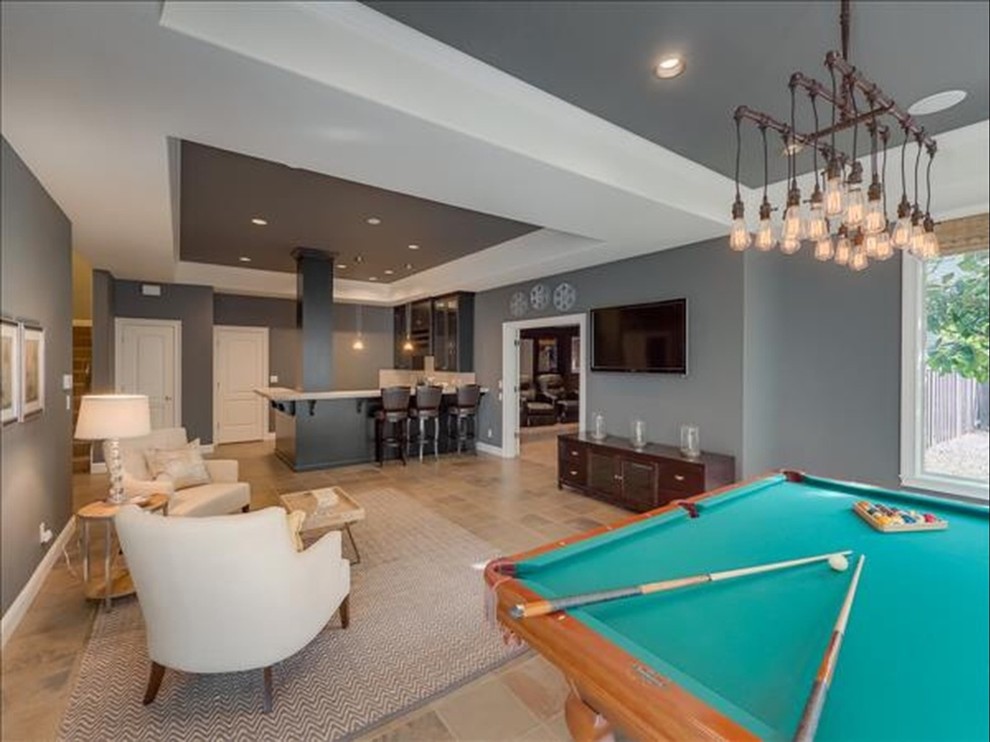 This is an example of a large traditional walk-out basement in Portland with grey walls, slate flooring and no fireplace.