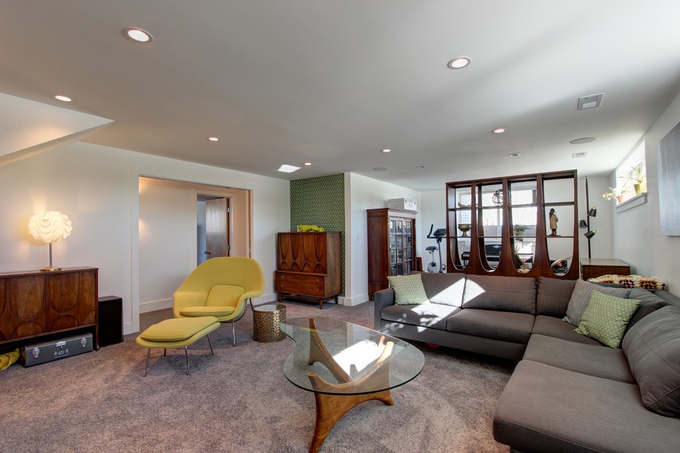 Inspiration for a mid-sized 1950s look-out carpeted basement remodel in Denver with white walls and no fireplace