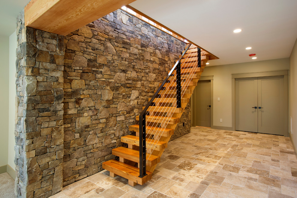 Rustic walk-out basement in DC Metro with green walls and ceramic flooring.