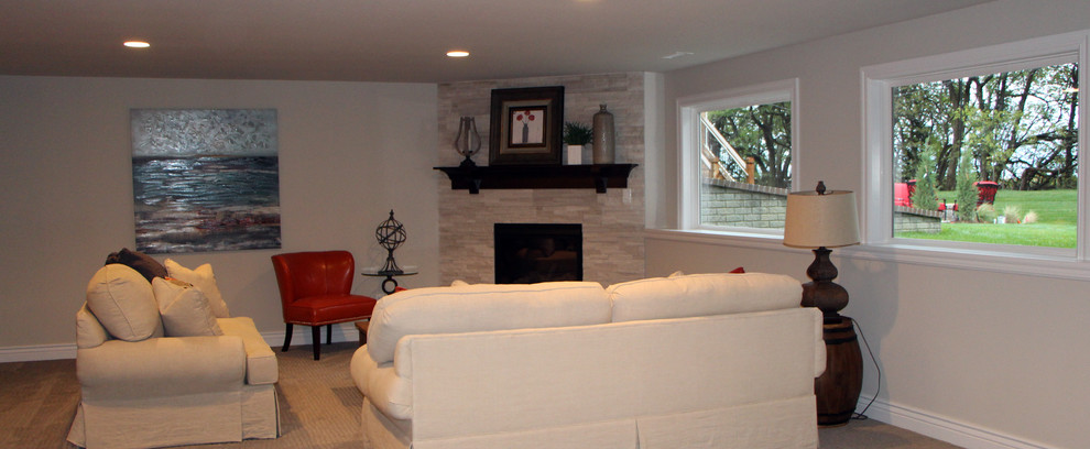 Photo of a large contemporary walk-out basement in Wichita with a corner fireplace.