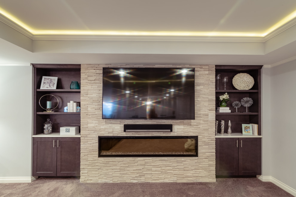 Example of a large transitional look-out carpeted and brown floor basement design in Chicago with gray walls, a ribbon fireplace and a stone fireplace