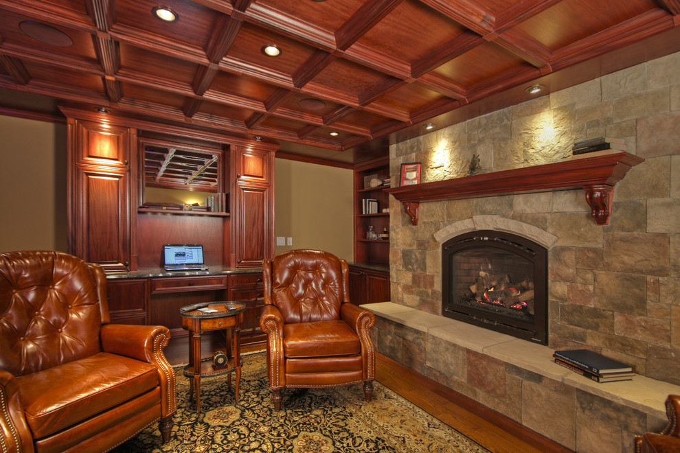 Design ideas for a large classic walk-out basement in St Louis with beige walls, a standard fireplace and a stone fireplace surround.