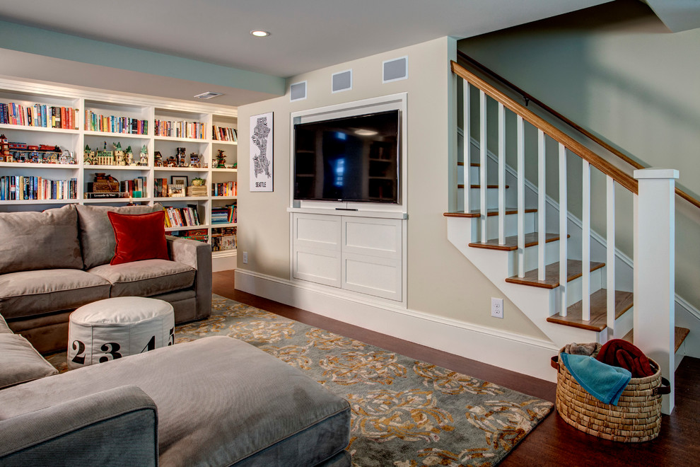 Inspiration for a timeless walk-out dark wood floor and brown floor basement remodel in Seattle with beige walls and no fireplace