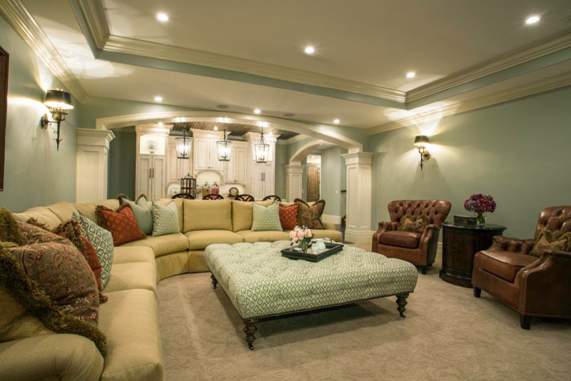 This is an example of a large classic fully buried basement in Salt Lake City with carpet, no fireplace, beige floors and green walls.