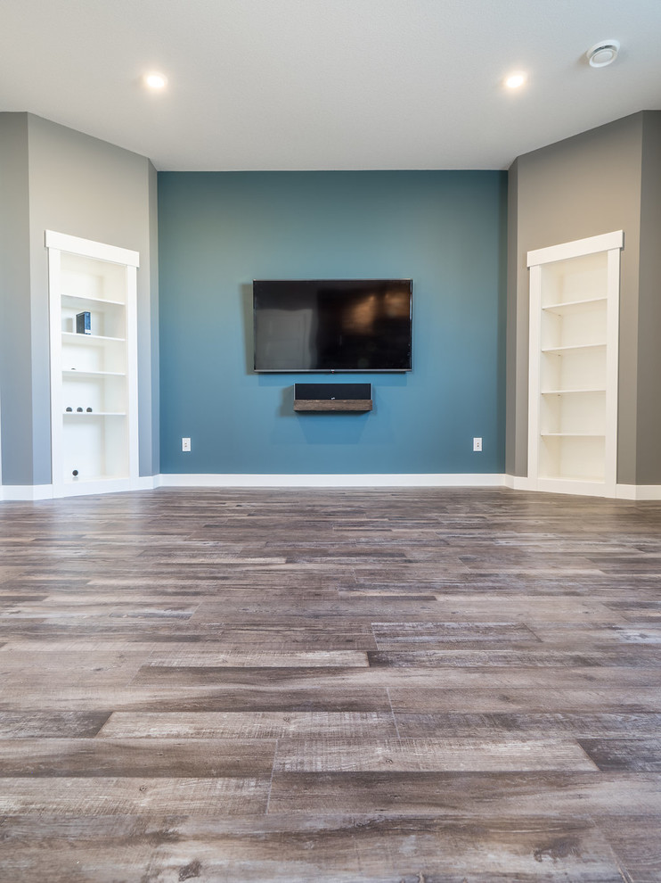 Design ideas for a medium sized contemporary look-out basement in Edmonton with blue walls, vinyl flooring and multi-coloured floors.