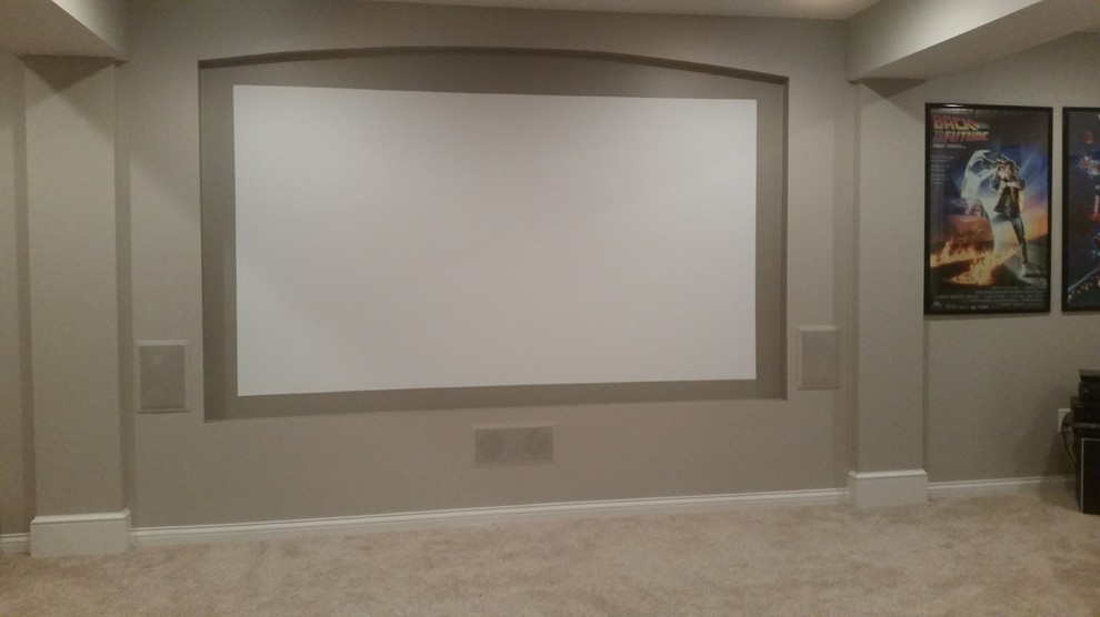 Large classic look-out basement in Cincinnati with grey walls and carpet.