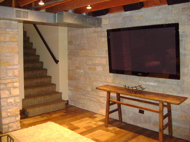 Basement - small transitional underground medium tone wood floor basement idea in Chicago with no fireplace