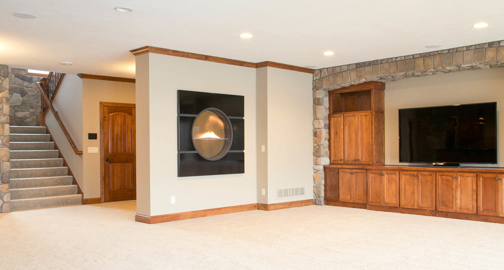 Photo of a classic walk-out basement in Minneapolis with beige walls and carpet.