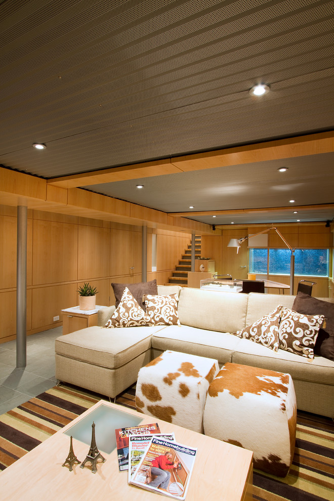 Inspiration for a large 1950s look-out carpeted and green floor basement remodel in Philadelphia with brown walls and no fireplace