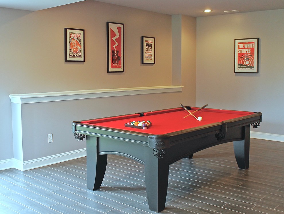 Example of a large trendy look-out vinyl floor and brown floor basement design in Philadelphia with gray walls and no fireplace