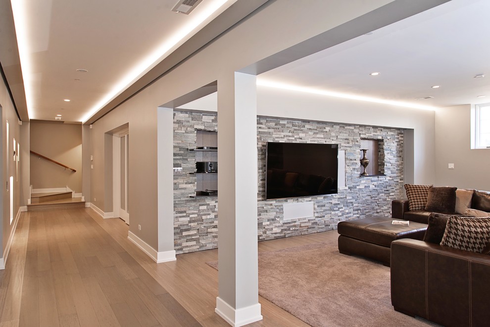 Large transitional look-out bamboo floor basement photo in Chicago with gray walls and no fireplace