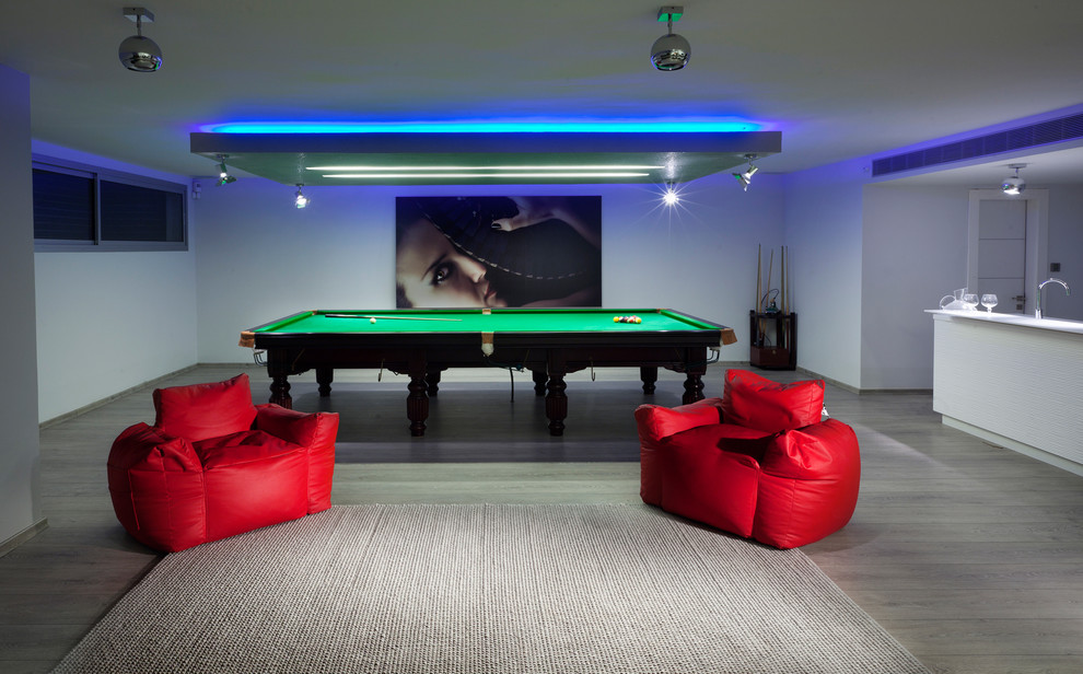 Inspiration for a contemporary look-out basement remodel in Other with white walls