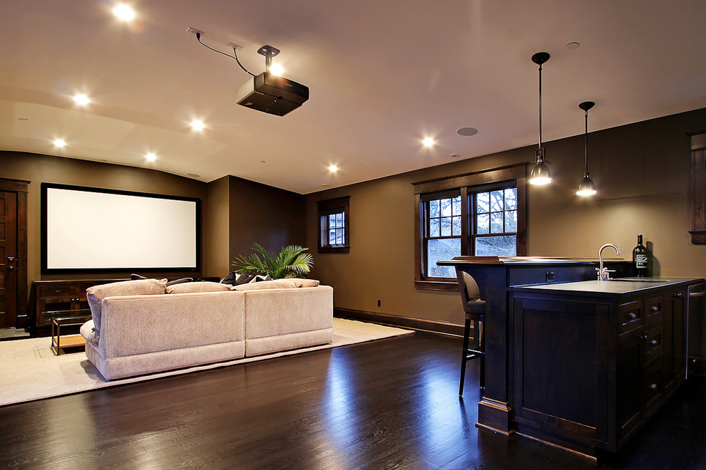 Inspiration for a large contemporary dark wood floor home theater remodel in Seattle with brown walls