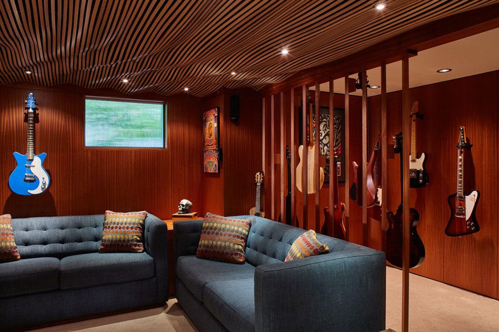 Example of a mid-sized 1950s look-out carpeted basement design in Portland with beige walls
