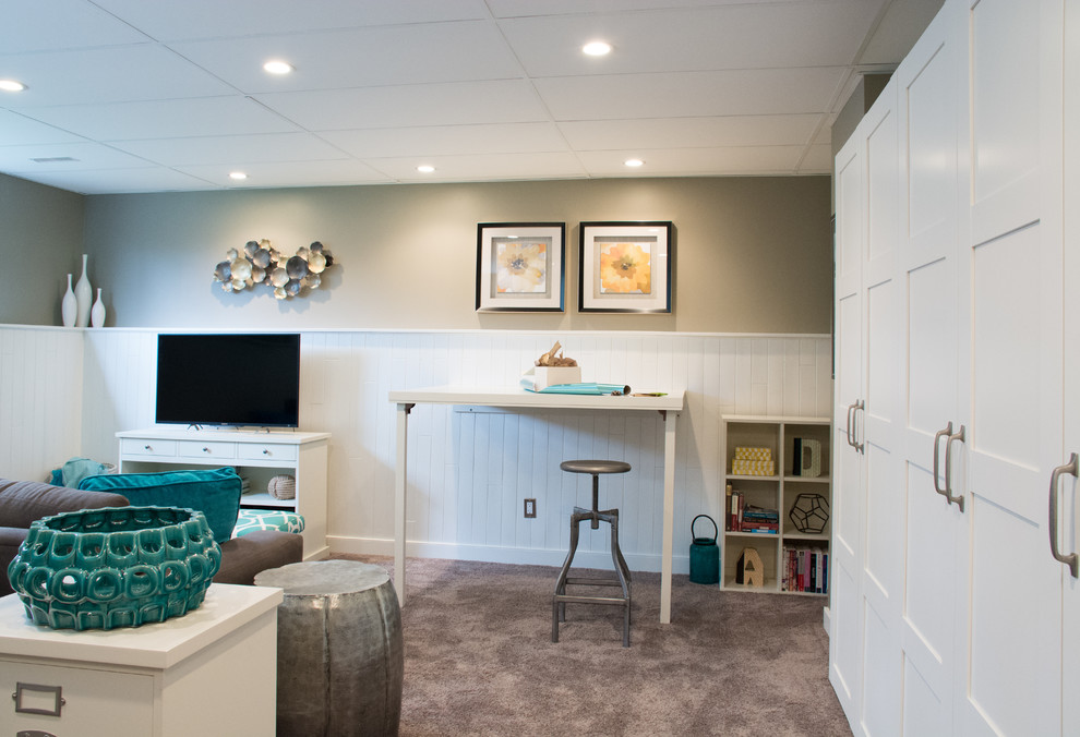 Small classic look-out basement in Calgary with carpet, no fireplace, green walls and brown floors.