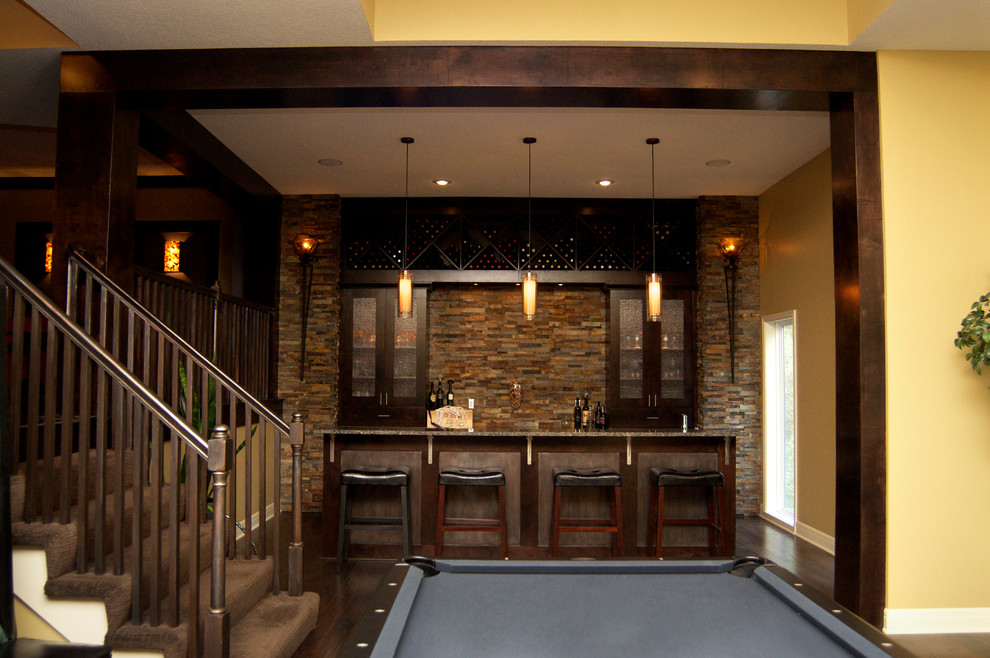 Inspiration for a large modern look-out dark wood floor and brown floor basement remodel in Kansas City with beige walls and no fireplace