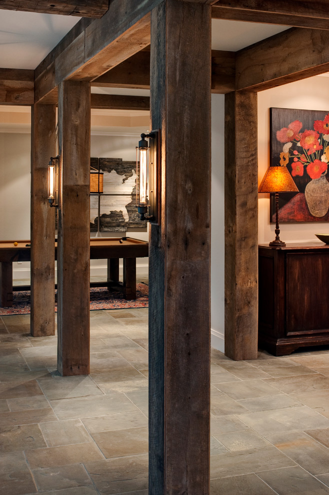 Inspiration for a large rustic basement in Richmond with beige walls, slate flooring, no fireplace and beige floors.