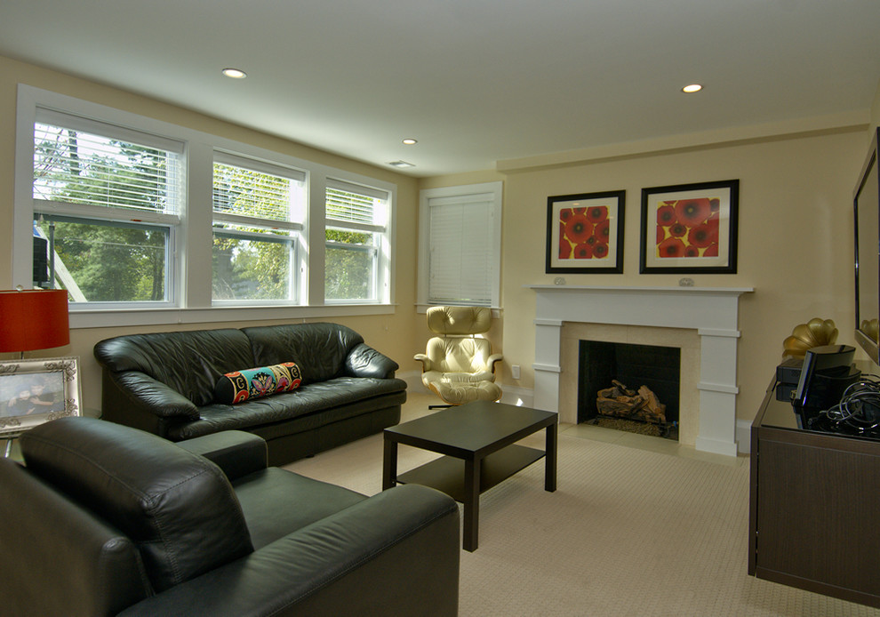 Example of a mid-sized transitional walk-out carpeted basement design in DC Metro with yellow walls, a standard fireplace and a tile fireplace