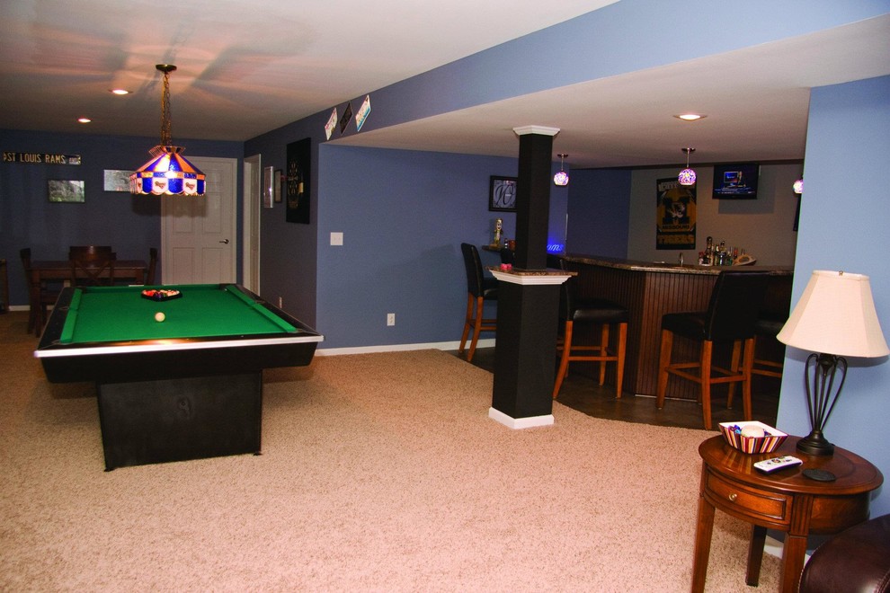 Photo of a large traditional basement in St Louis.