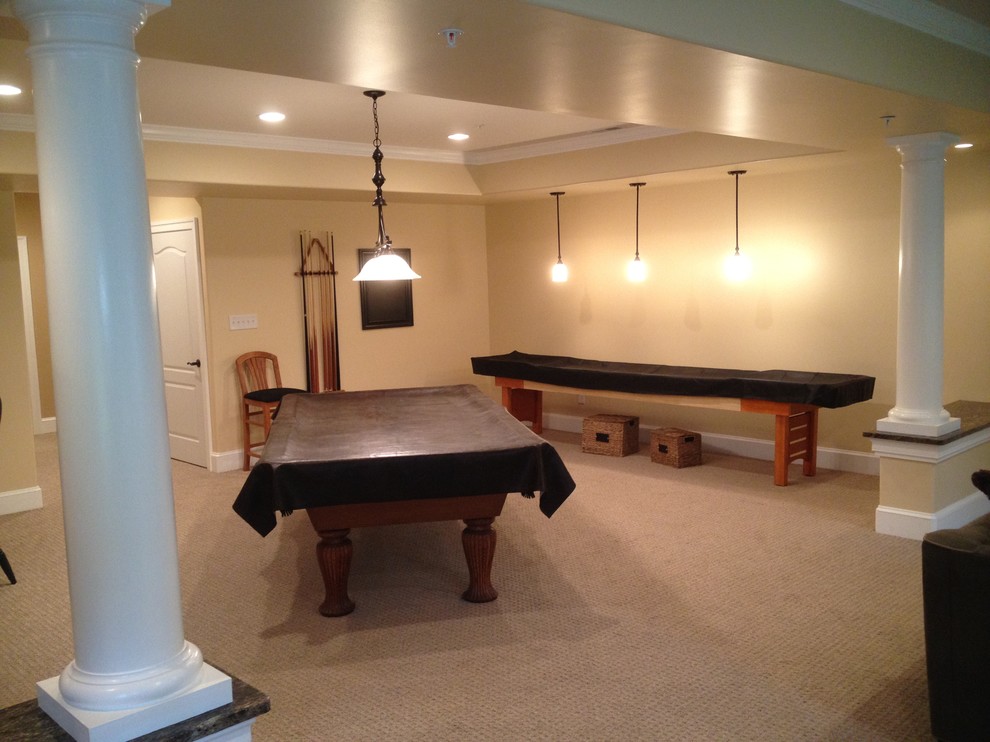 Large elegant underground carpeted basement photo in Baltimore with beige walls and no fireplace