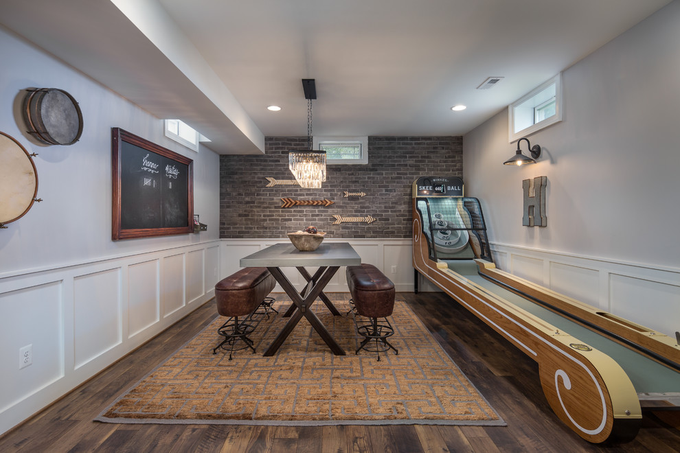 Example of a classic look-out dark wood floor basement game room design in DC Metro with gray walls