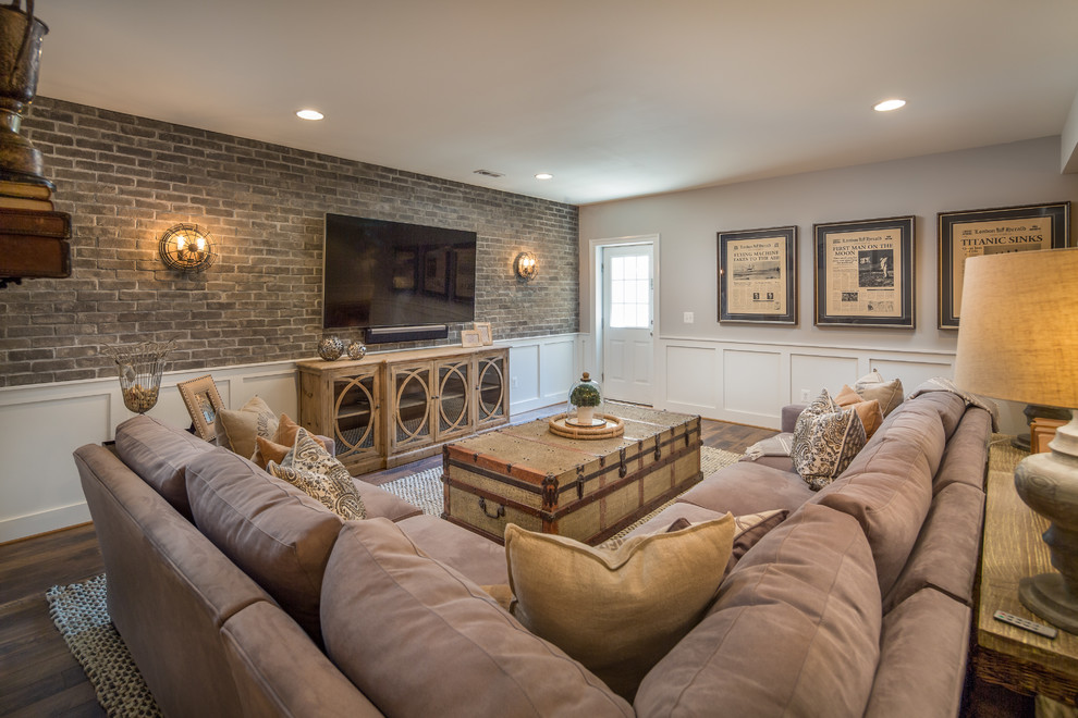 Example of a classic walk-out medium tone wood floor basement design in DC Metro