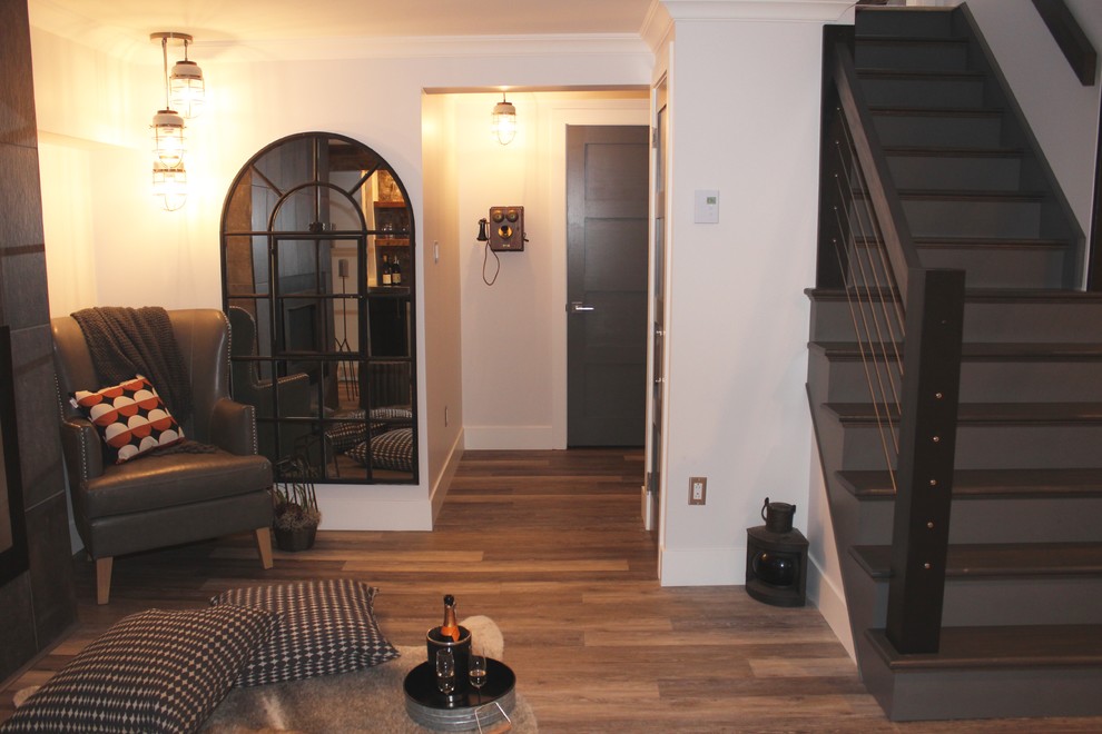 Photo of a large modern look-out basement in Calgary with grey walls, laminate floors and brown floors.
