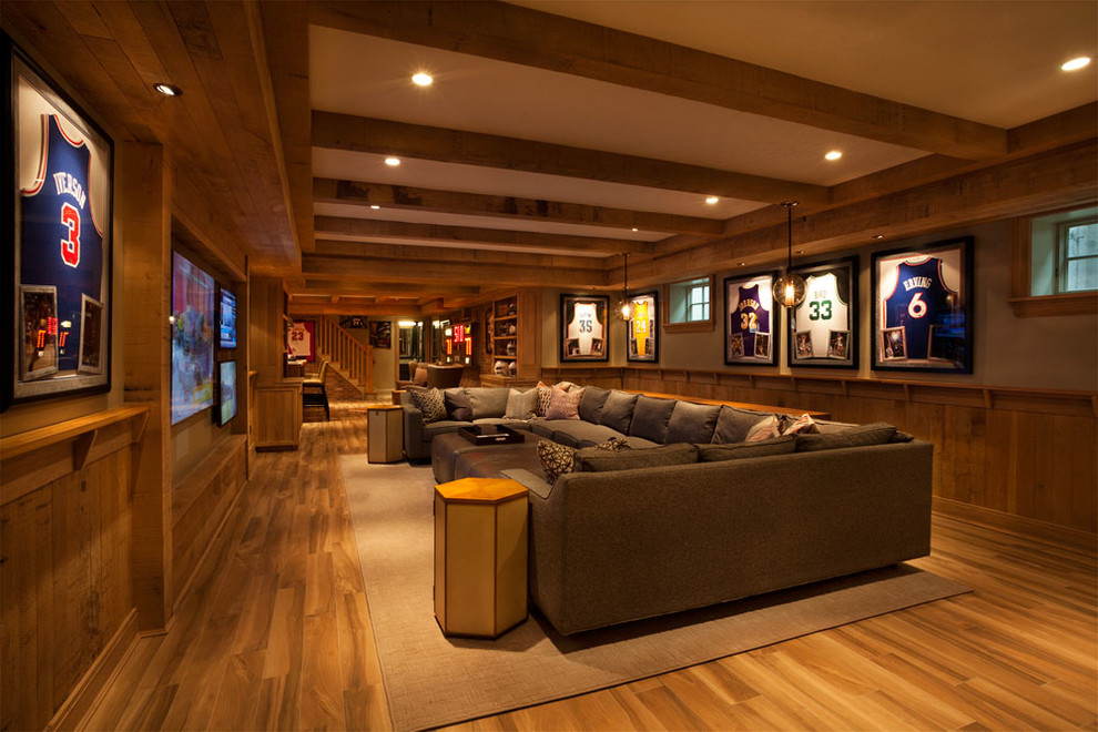 Huge elegant medium tone wood floor and yellow floor basement photo in New York with beige walls and no fireplace