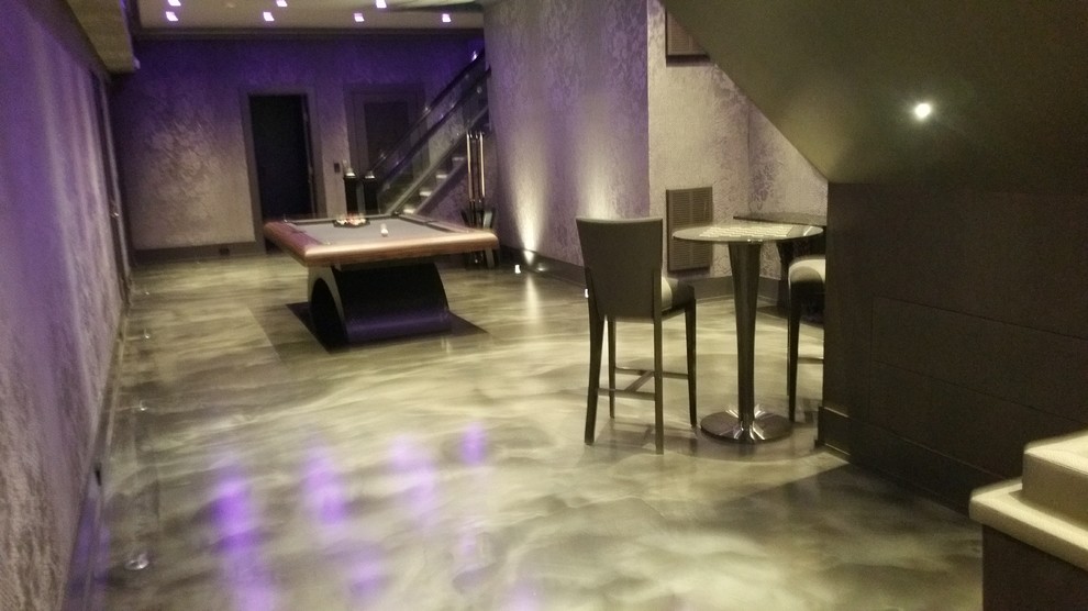 Idee per una taverna design con pavimento in cemento