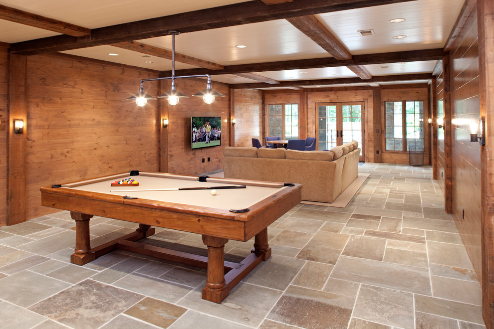 Design ideas for a rustic walk-out basement in Minneapolis with brown walls and slate flooring.