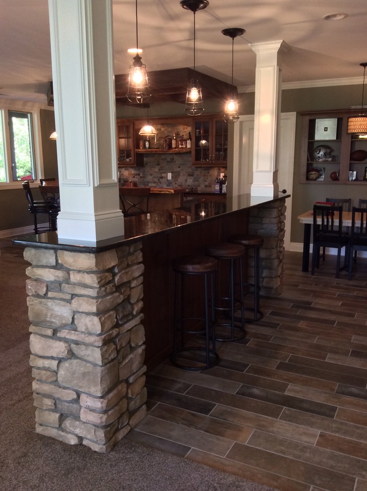 Example of a transitional home bar design in Detroit