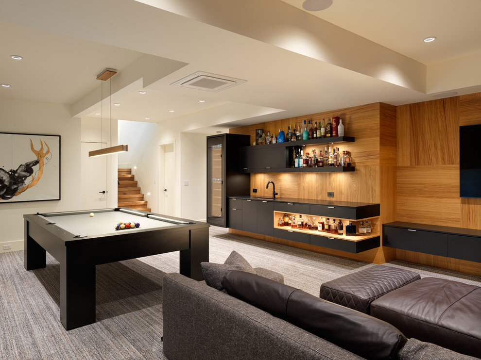 This is an example of a contemporary games room in Other with white walls, carpet and grey floors.