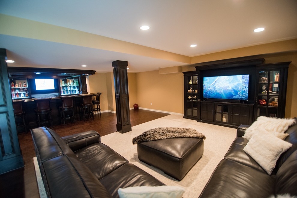 Photo of a large classic home cinema in Detroit with vinyl flooring and brown floors.