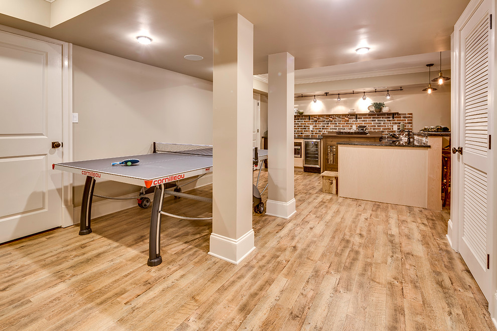 Inspiration for a large rustic walk-out light wood floor basement remodel in Baltimore with beige walls