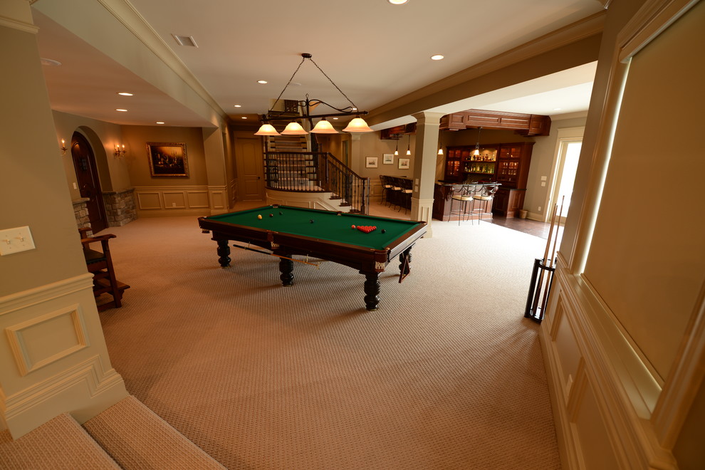 This is an example of an expansive traditional walk-out basement in Indianapolis with beige walls.