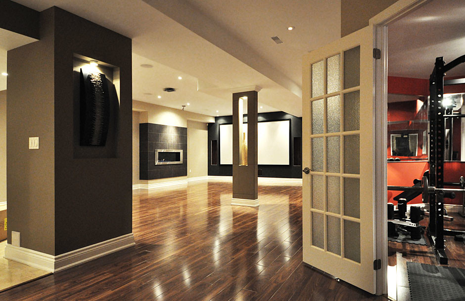 Example of a trendy brown floor basement design in Toronto