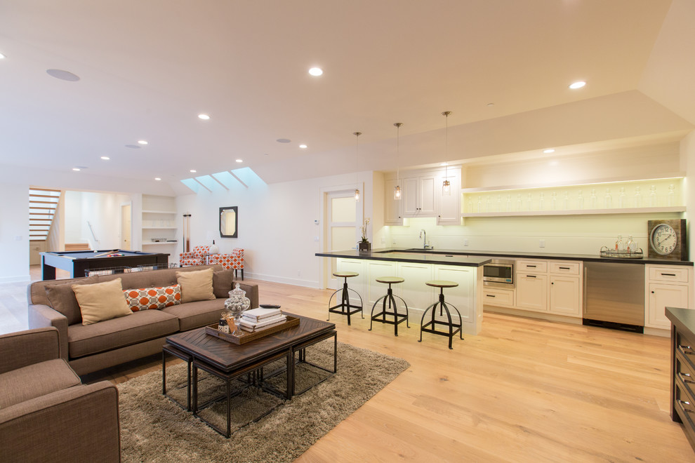 Inspiration for a large timeless walk-out light wood floor basement remodel in San Francisco with white walls