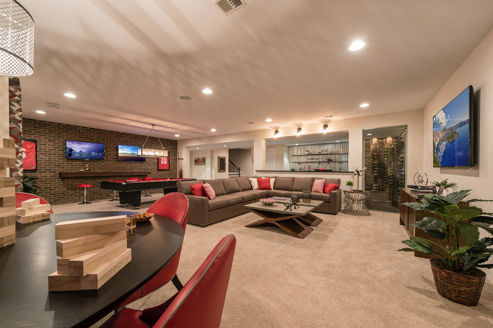 This is an example of a medium sized traditional walk-out basement in Cincinnati with white walls and carpet.