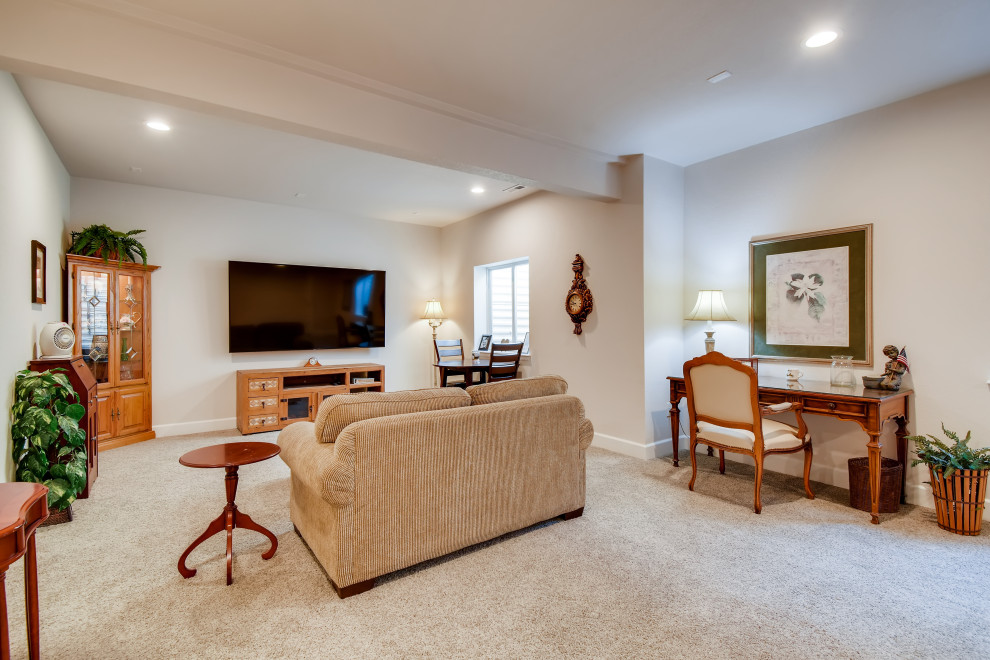 Inspiration for a small classic look-out basement in Denver with beige walls, carpet and beige floors.