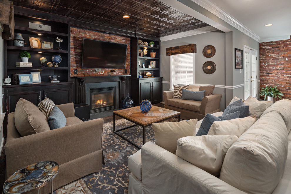 Traditional living room in DC Metro with grey walls, carpet, a standard fireplace and multi-coloured floors.