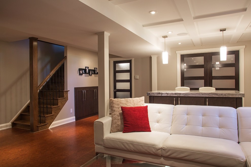 This is an example of a medium sized classic look-out basement in Ottawa with grey walls, cork flooring and no fireplace.