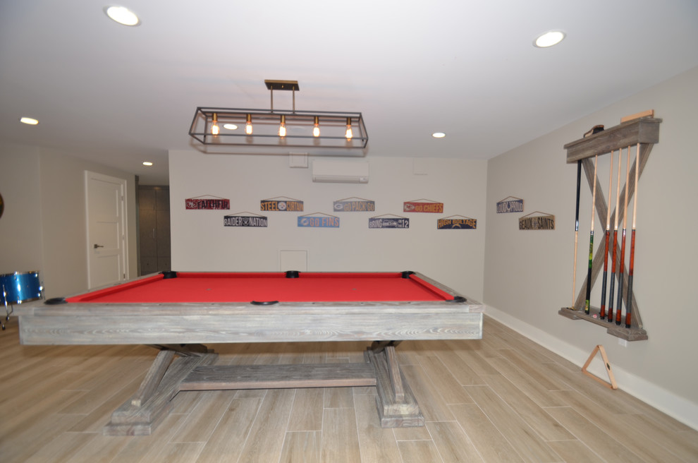 Design ideas for a large traditional walk-out basement in New York with grey walls and porcelain flooring.